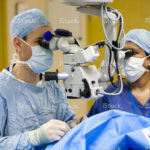stock-photo-23130432-consultant-ophthalmologist-operating