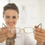 stock-photo-41330246-closeup-on-ophthalmologist-doctor-woman-giving-eyeglasses